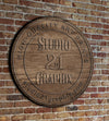 Studio21Graphix wood sign on brick building